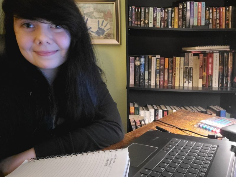 Casey Haney is pictured at her desk in front of her computer in her home office.