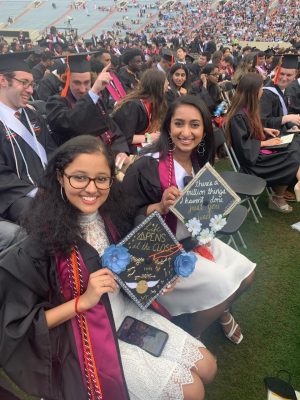 Students show off their graduation caps