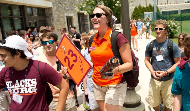 Photo of student leading new student orientation tour